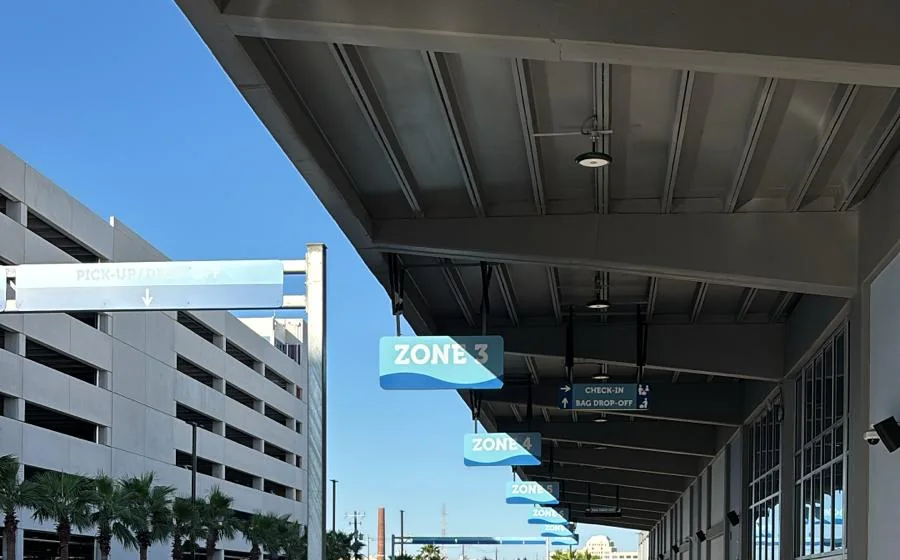 Numbered curbside pickup and drop-off zone signs at Galveston Cruise Terminal 16