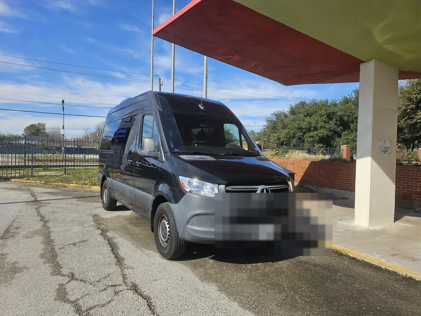 Black Mercedes-Benz Sprinter shuttle van used for the shared $39 Houston to Galveston cruise port run