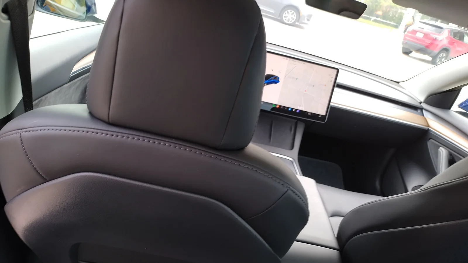 Rear cabin view and touchscreen inside the Tesla Model 3